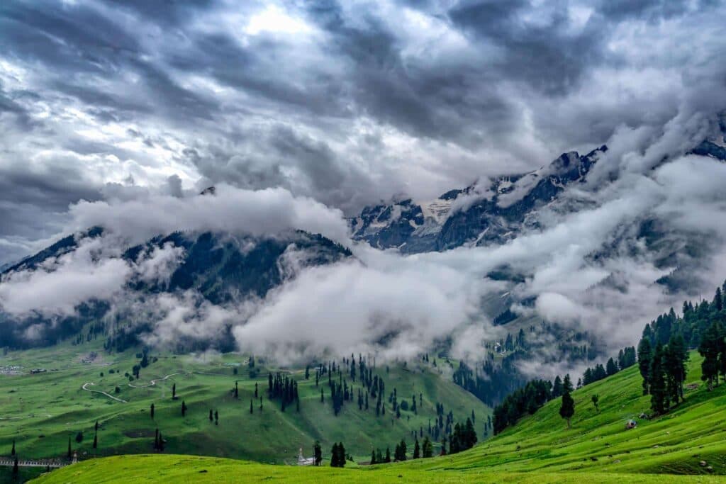 Kashmir in July and August with lush green valleys during the monsoon season.